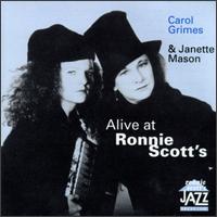 An ad showing Janette Mason and Carol Grimes posing with hats on, for a gig 'Alive at Ronnie Scott's' jazz club.