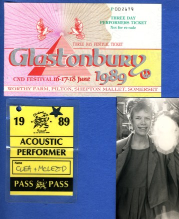 A page from Cinders' scrapbook showing a ticket to the group's performance, a backstage pass, and a hazy photo taken at the event.
