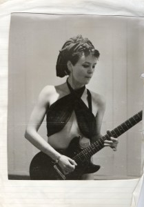 Pauline playing electric guitar