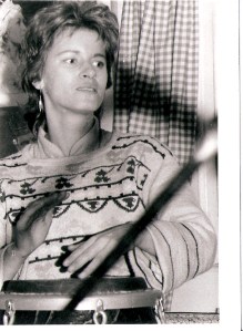 The Guest Stars' conga player, Linda, looking very focused, playing at a rehearsal.