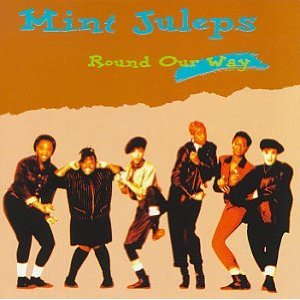 Album cover for the Mint Juleps. Orange background, turquoise lettering, 6 band members smiling and posing as if dancing and larking about..