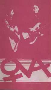 Ova album cover Red and white cover, picture of Rosemary and Jana playing guitar. Ova includes women's symbol around the 'O'