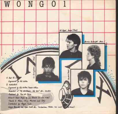 Four passport size photos of the band, super imposed over a clock face. Track info: 'Beat the Clock', 'Undecided', recorded at the Workhouse, produced by Tour de Force, distributed by Rough Trade.