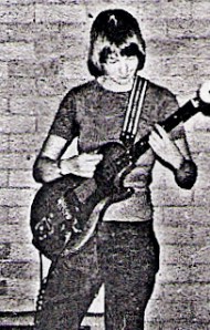 Alain (surname unknown) playing guitar rehearsing for a gig at the First National Lesbian conference in 1974. Not a lesbian herself, she supported the cause